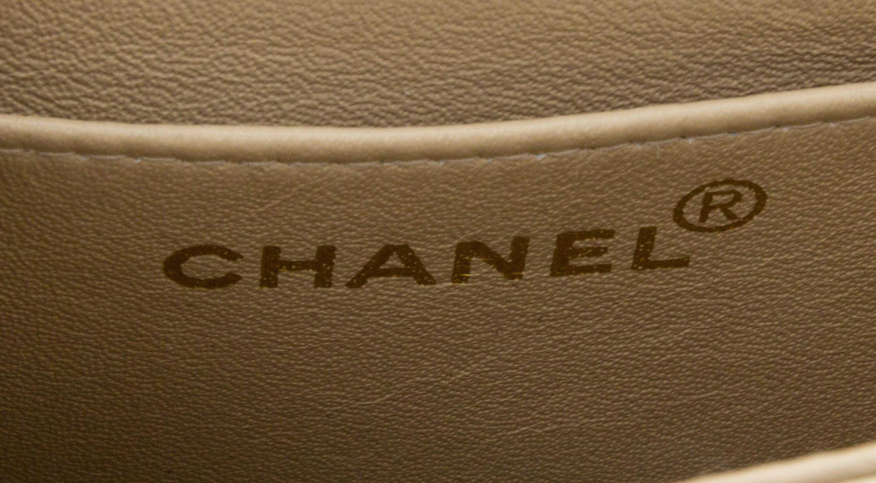 A Chanel Cream Calfskin Leather Small Flap Handbag, 6.5" x 5.5" x 2.5".