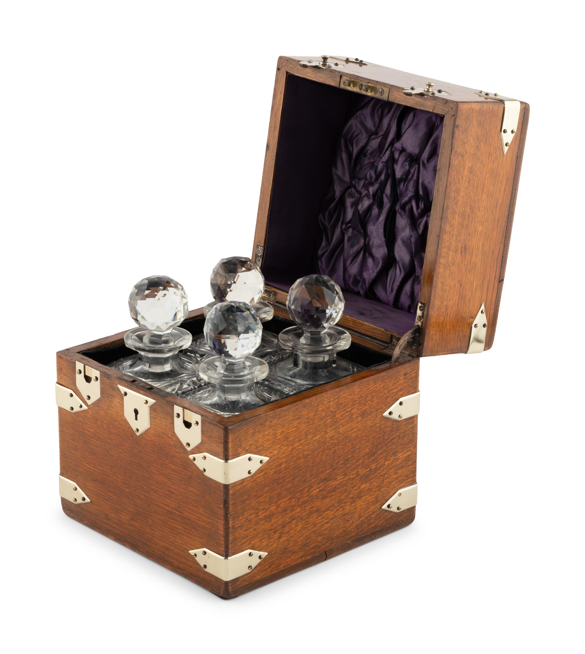 An English Mahogany Cased Four-Bottle Decanter Set