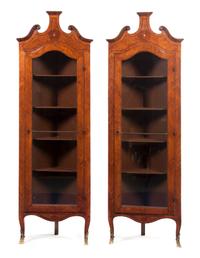 A Pair of Continental Parquetry Corner Cabinets, Height 75 1/2 x width 24 7/8 x depth 13 1/8 inches.