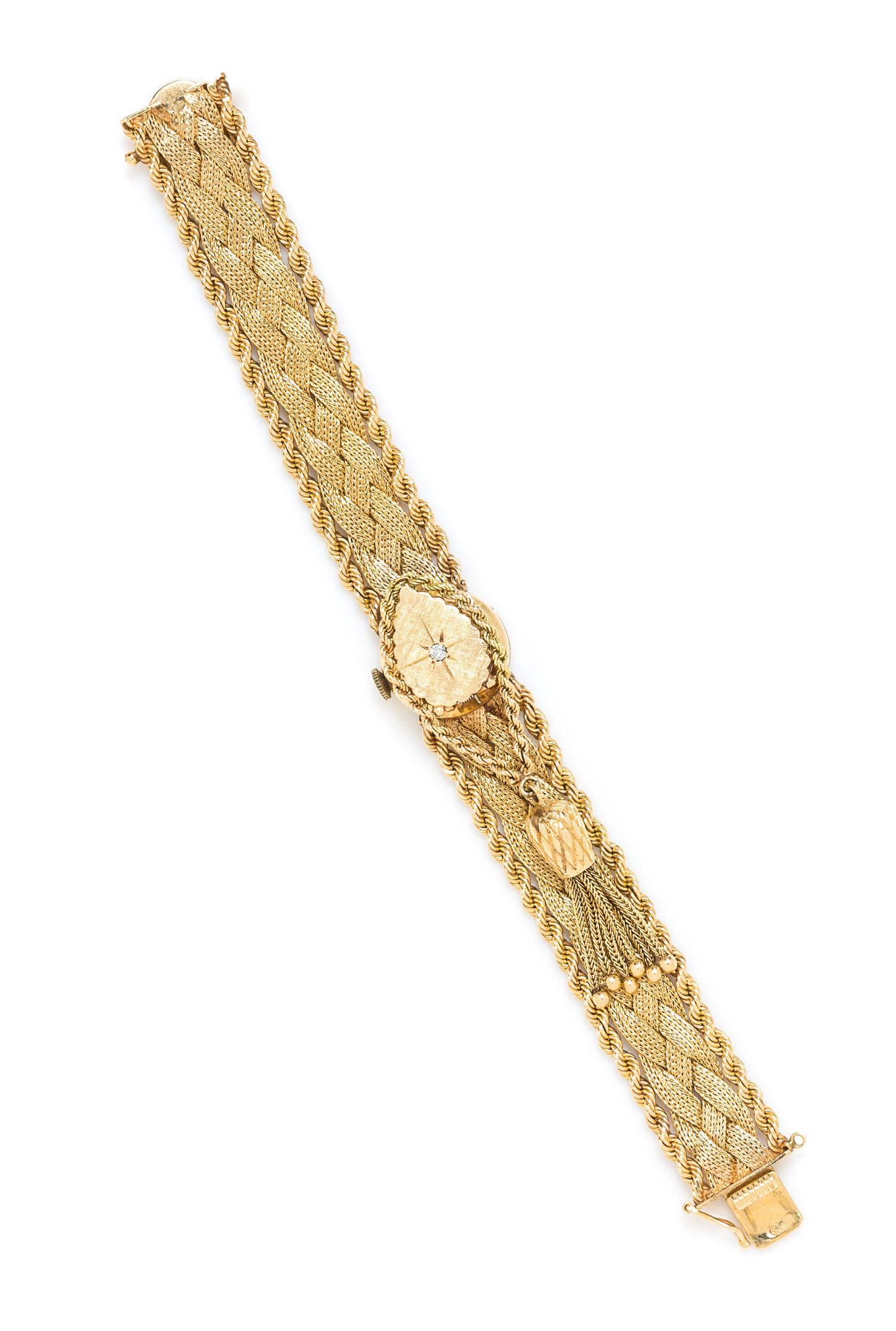 A 14 Karat Yellow Gold Surprise Watch, 26.00 dwts.