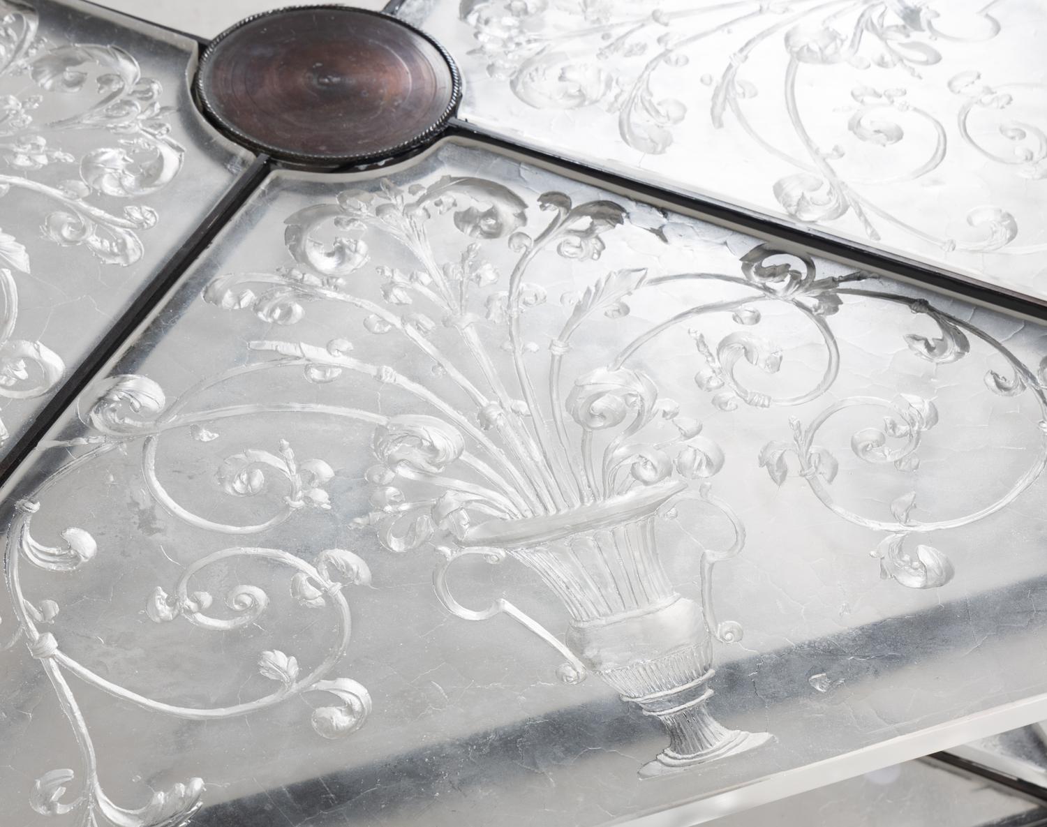 An Etched Glass-Top Patinated Metal Cocktail Table