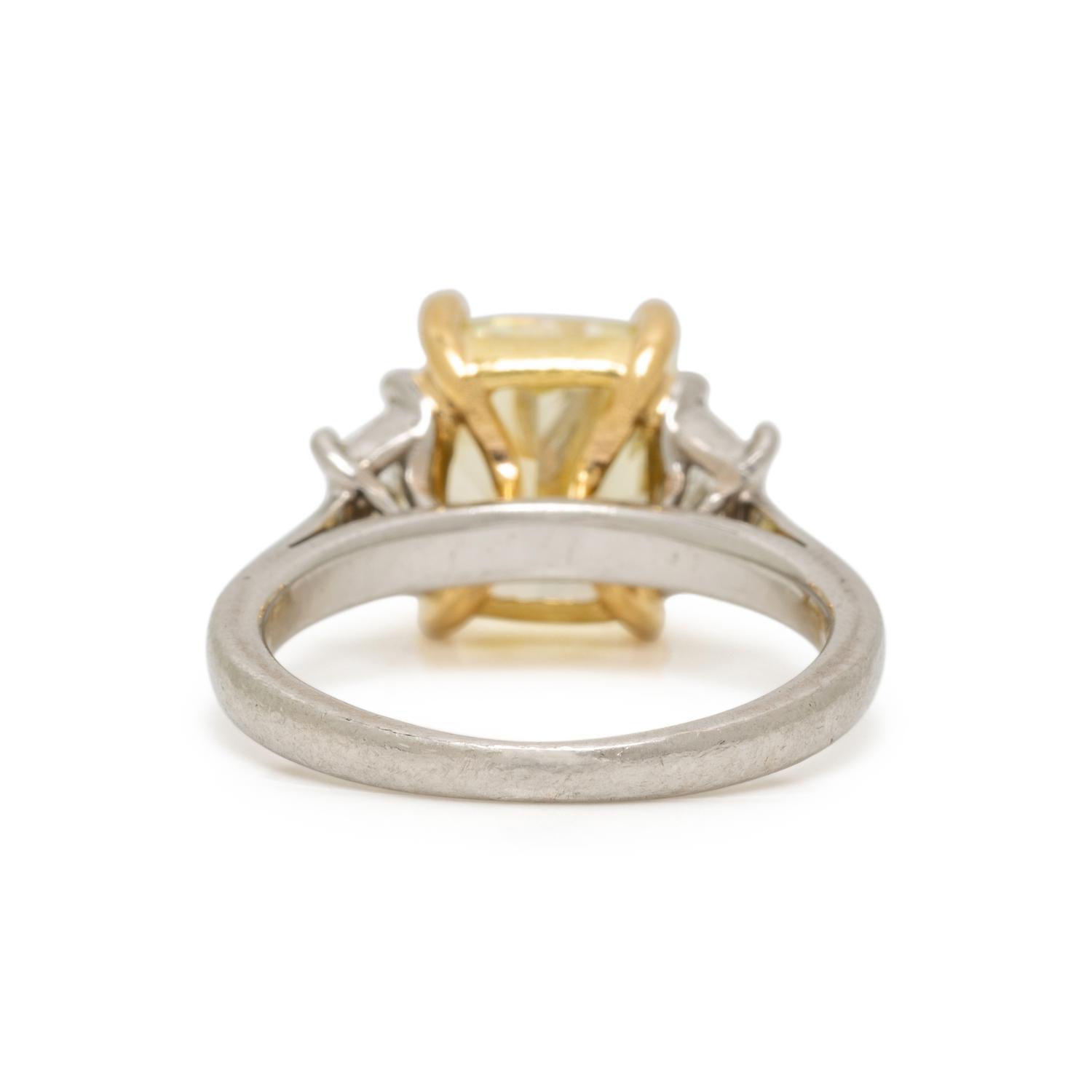 FANCY LIGHT YELLOW DIAMOND AND DIAMOND RING