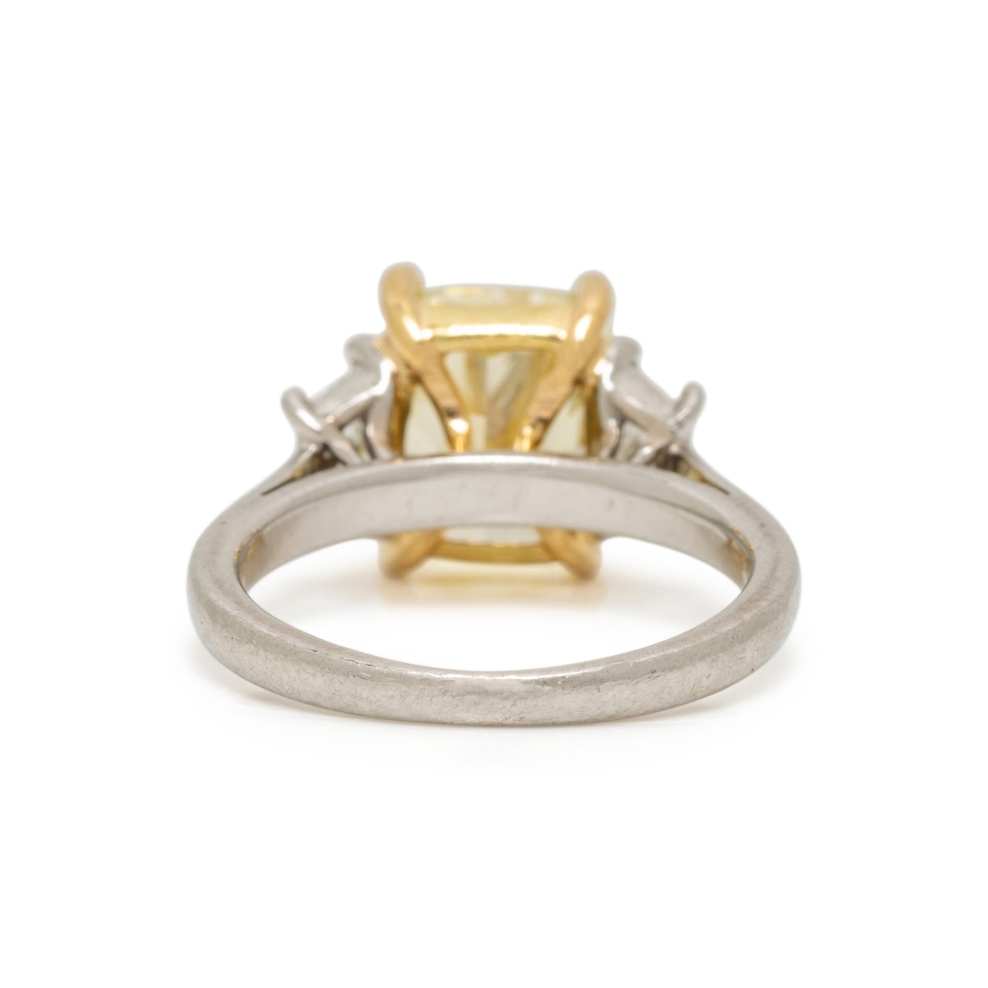 FANCY LIGHT YELLOW DIAMOND AND DIAMOND RING