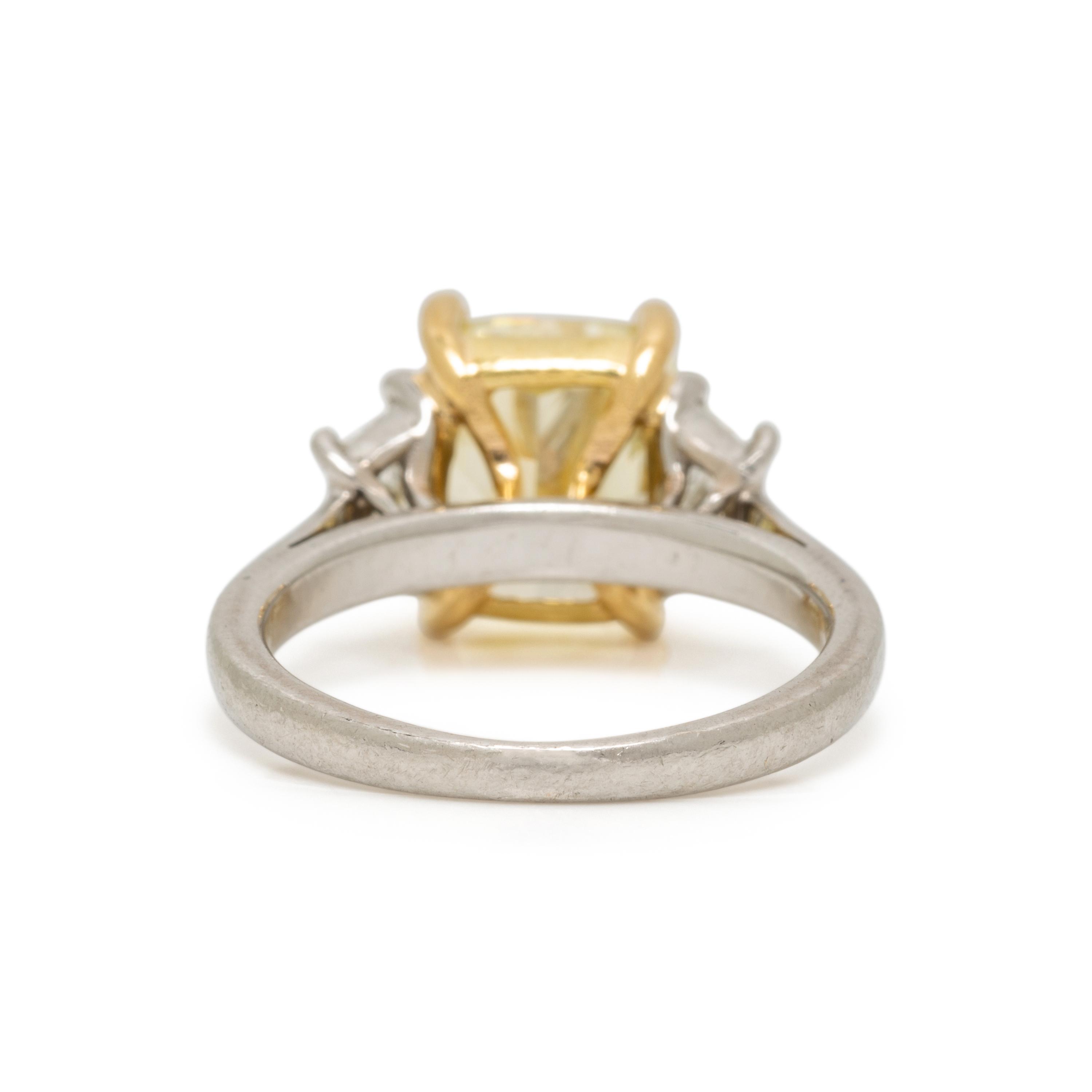 FANCY LIGHT YELLOW DIAMOND AND DIAMOND RING