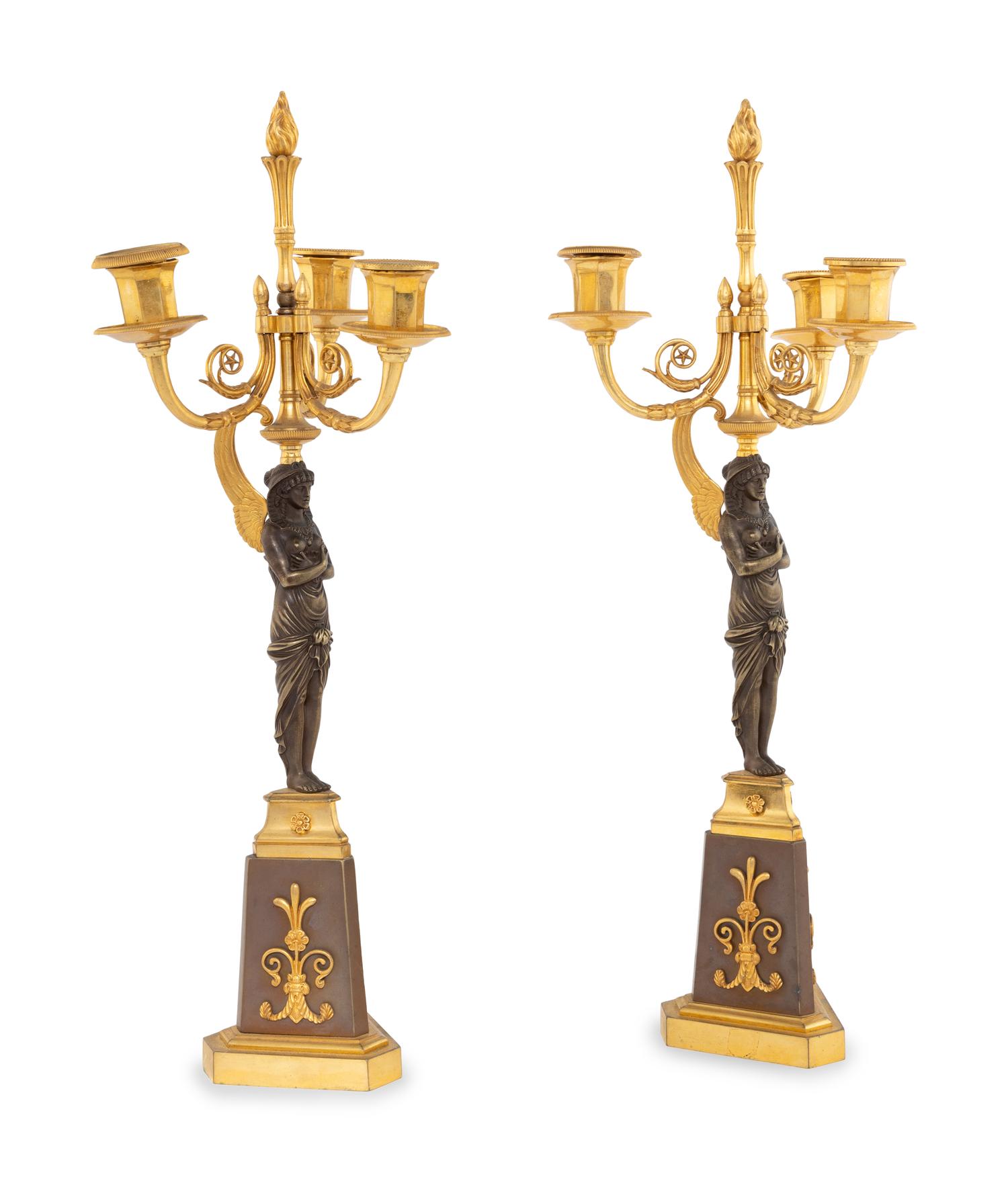 A Pair of Empire Style Gilt and Patinated Bronze Figural Candelabra