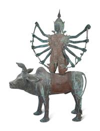 A Tibetan Bronze Durga on Bull — 20TH CENTURY
