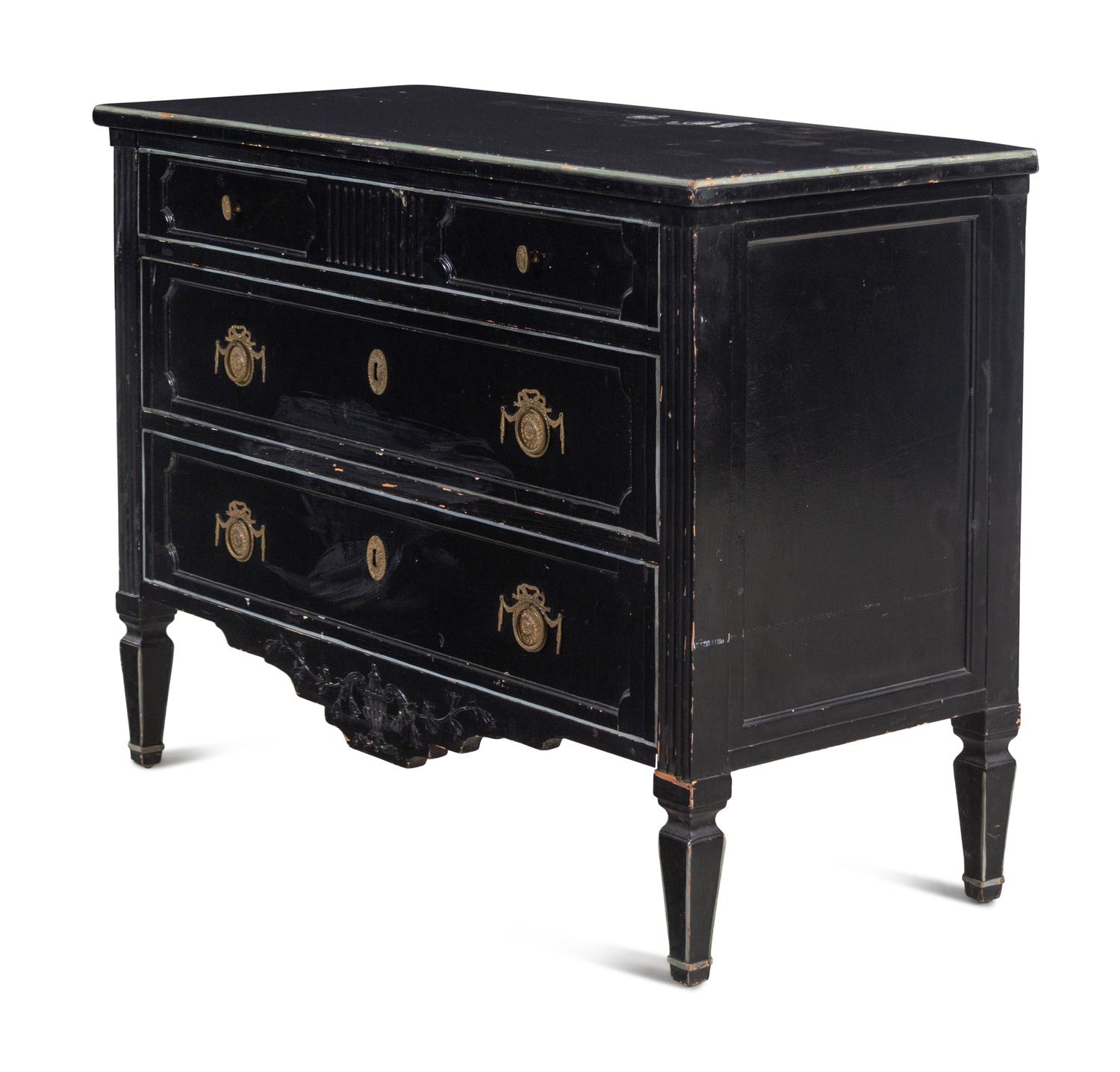 An Italian Gilt Metal Mounted Ebonized Chest of Drawers