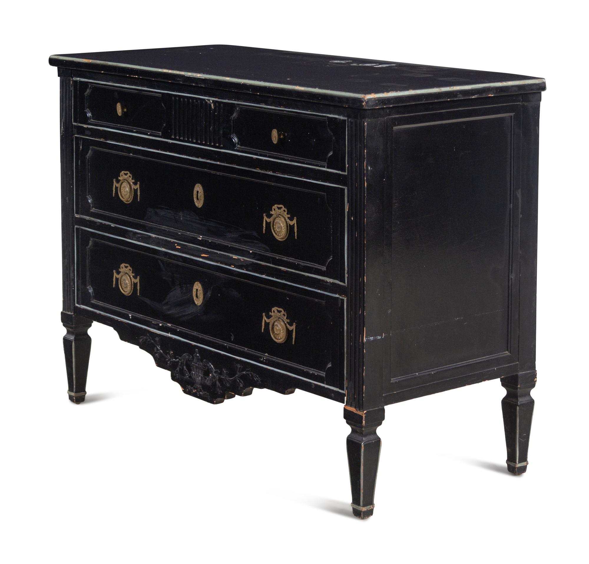 An Italian Gilt Metal Mounted Ebonized Chest of Drawers