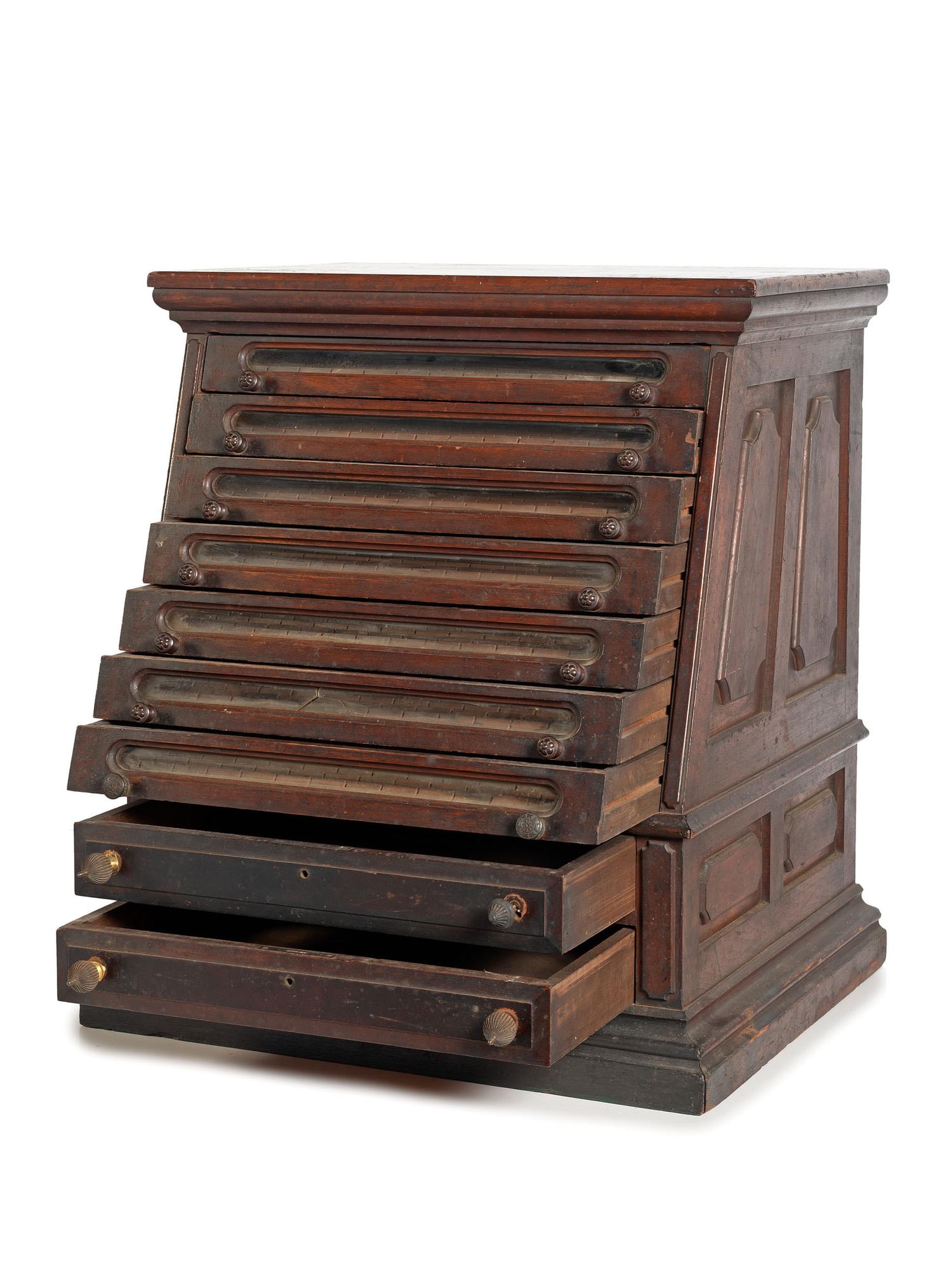 A Nine Drawer Counter Top Spool Cabinet