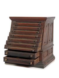 A Nine Drawer Counter Top Spool Cabinet