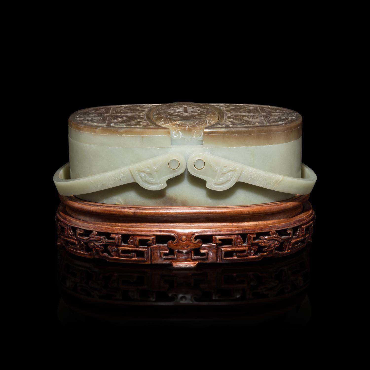 A Chinese Pale Celadon and Russet Jade Box and Cover, 20th Century 近代 青玉提梁式蓋盒