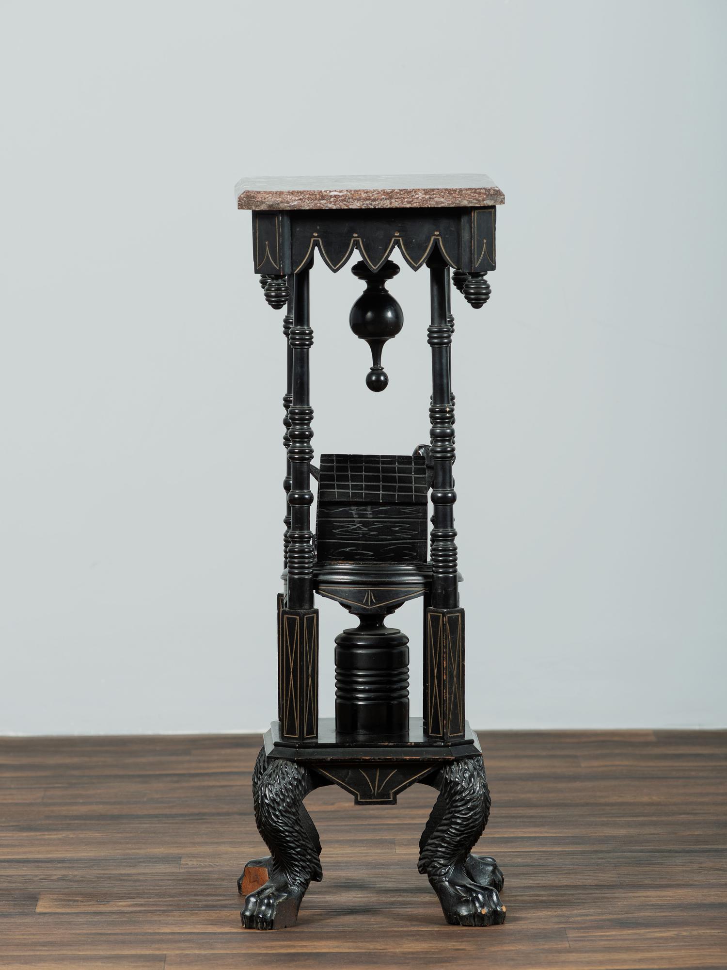 A Victorian Marble-Top Carved and Ebonized Parlor Table with Dog