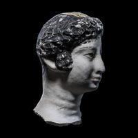 An Egyptian Painted Stucco Mummy Mask