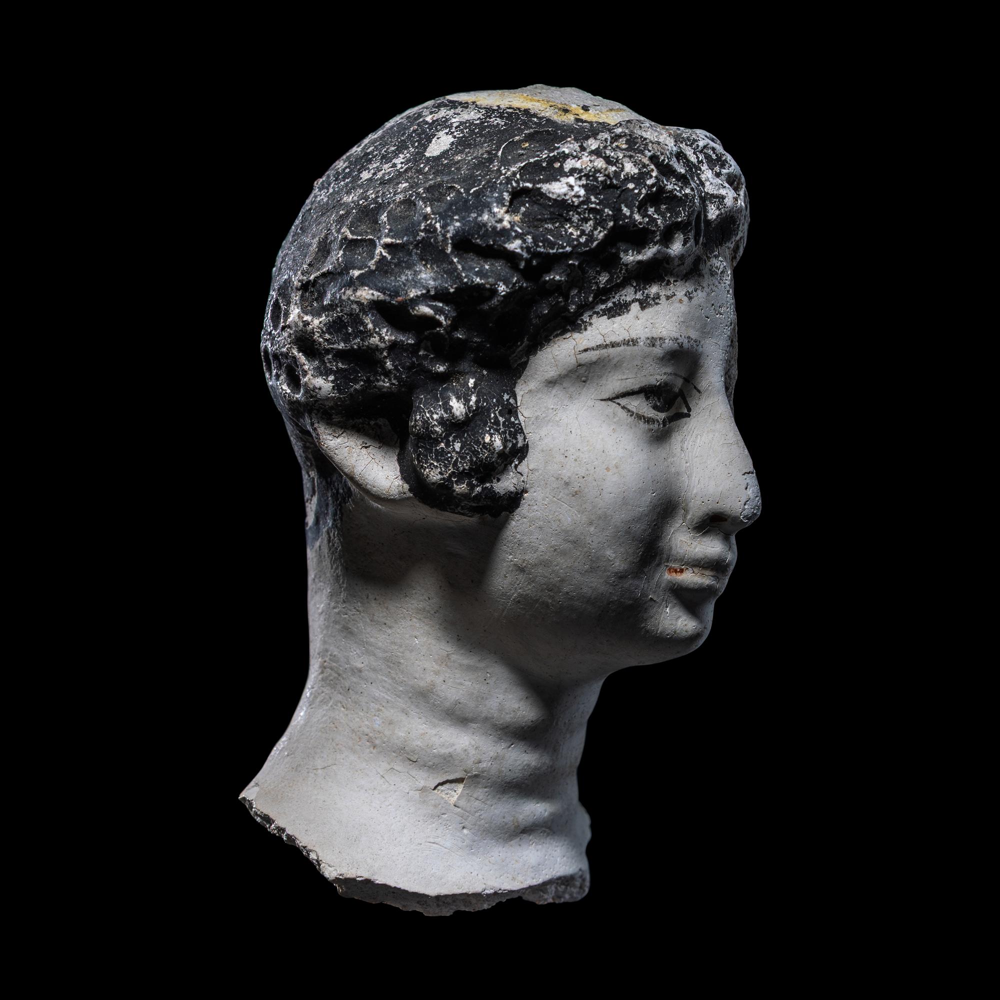 An Egyptian Painted Stucco Mummy Mask