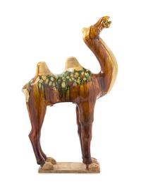 A Sancai Glazed Pottery Figure of a Camel TANG DYNASTY Height 22 3/4 inches. — TANG DYNASTY
