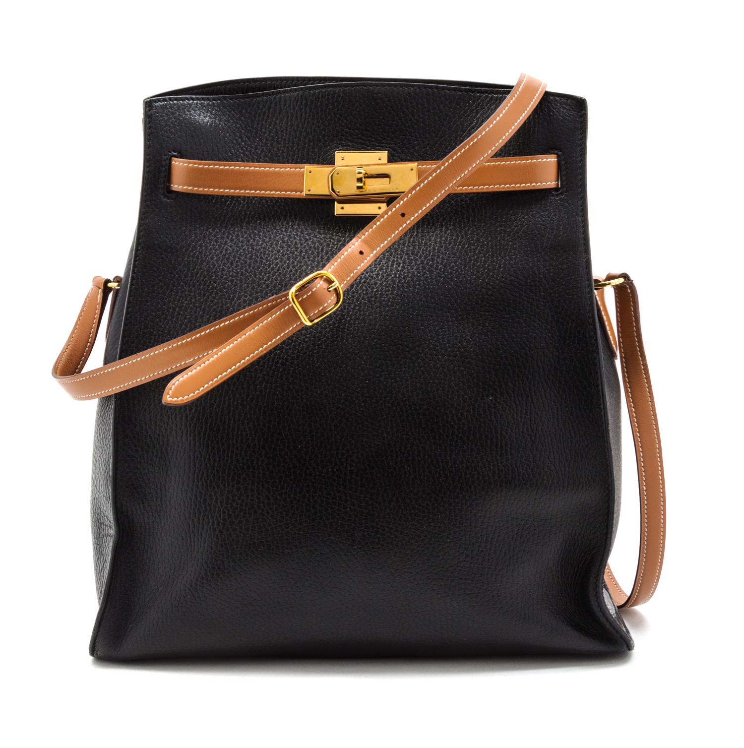 An Hermes 30cm Black Leather Kelly Sport Bag, 12 x 11 1/2 x 5 inches.