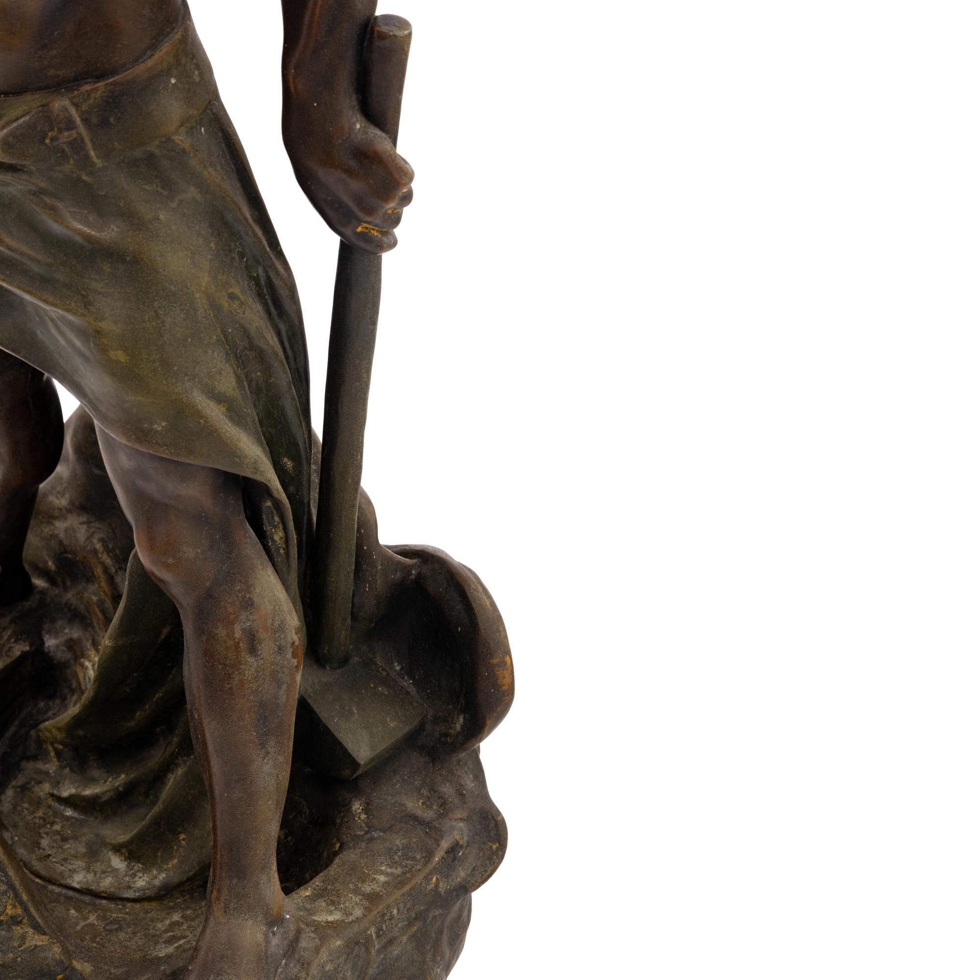 A Cast Metal Figural Newel Post Lamp