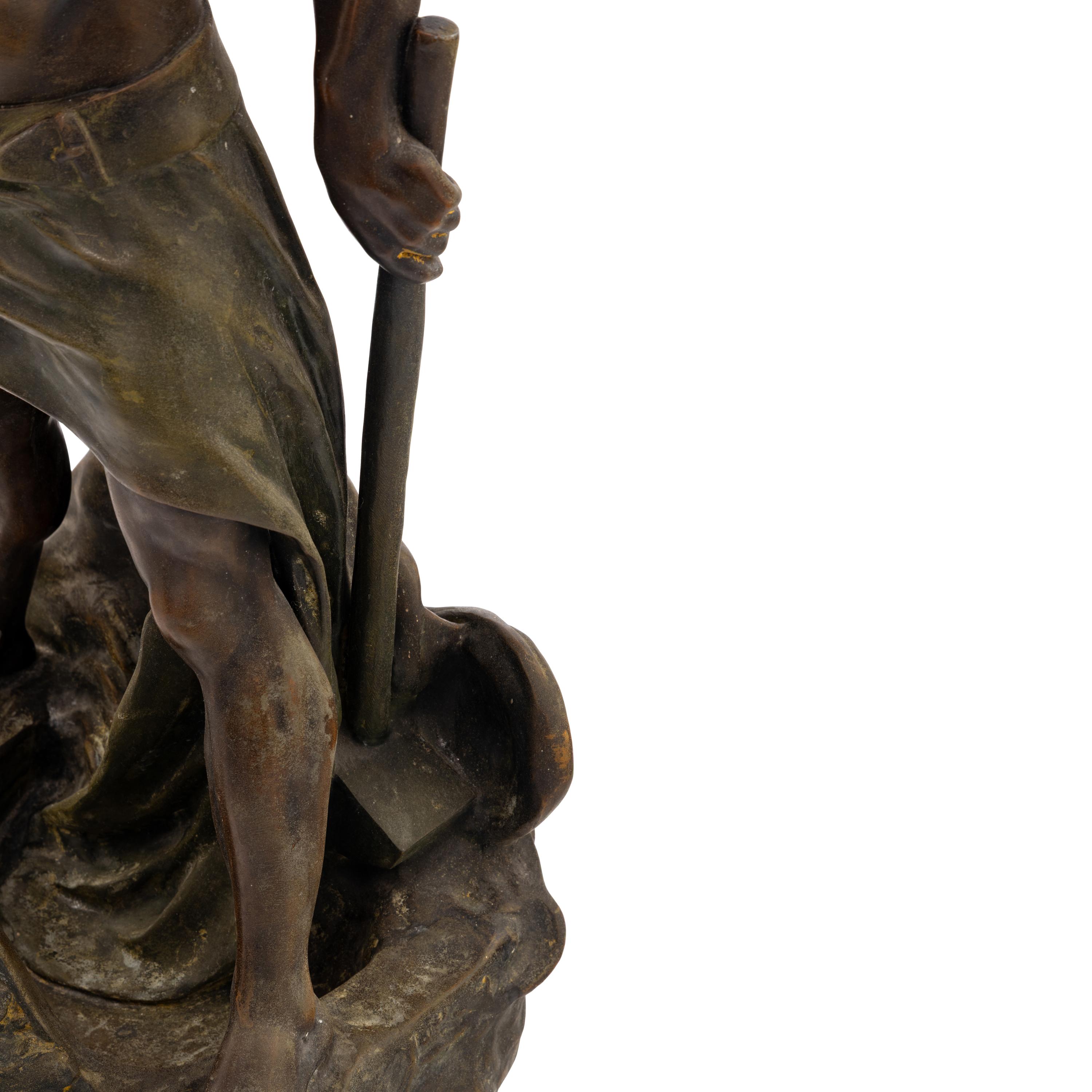 A Cast Metal Figural Newel Post Lamp