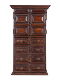 A Dutch Carved and Paneled Walnut Tall Chest of Drawers