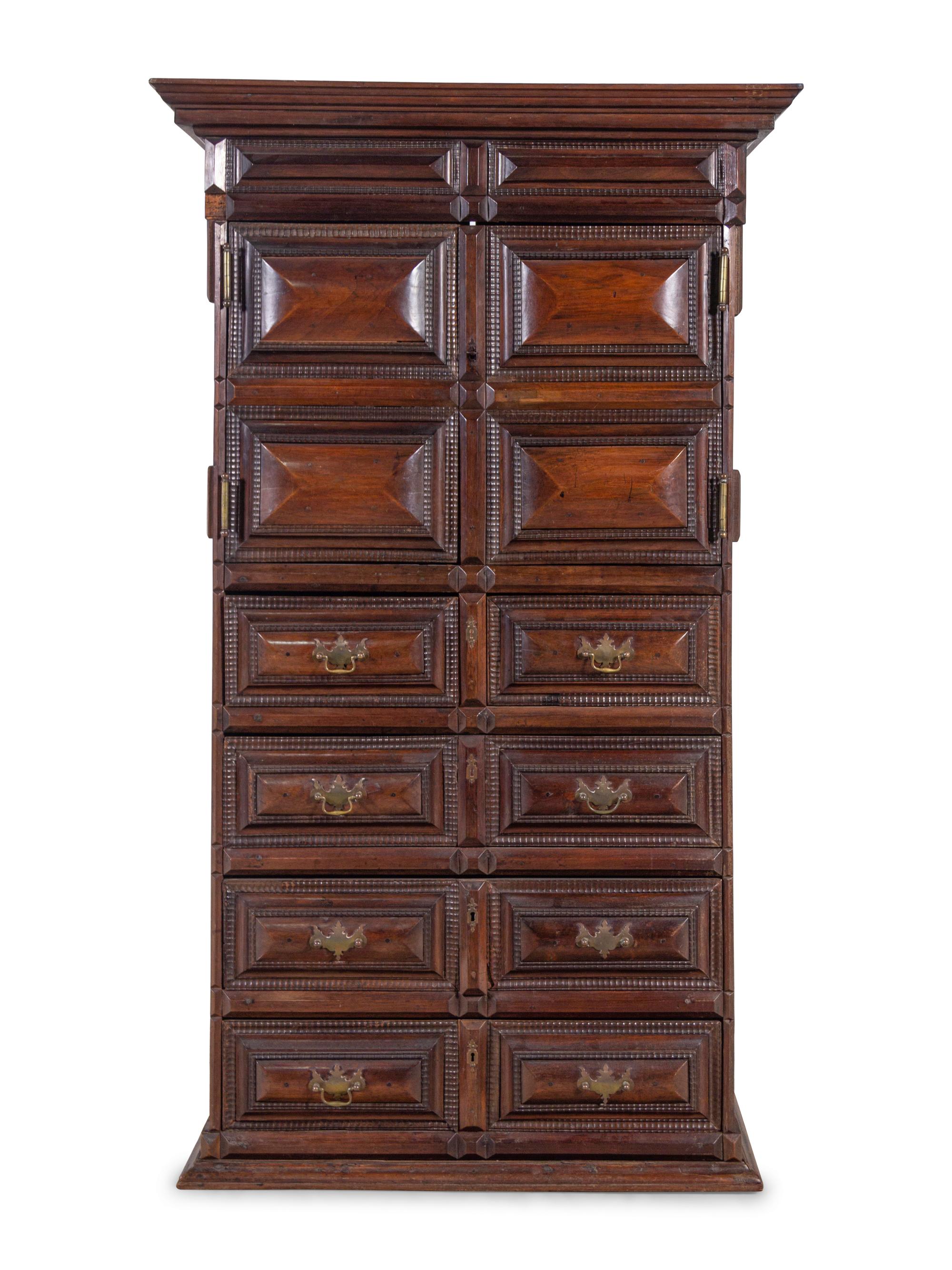 A Dutch Carved and Paneled Walnut Tall Chest of Drawers