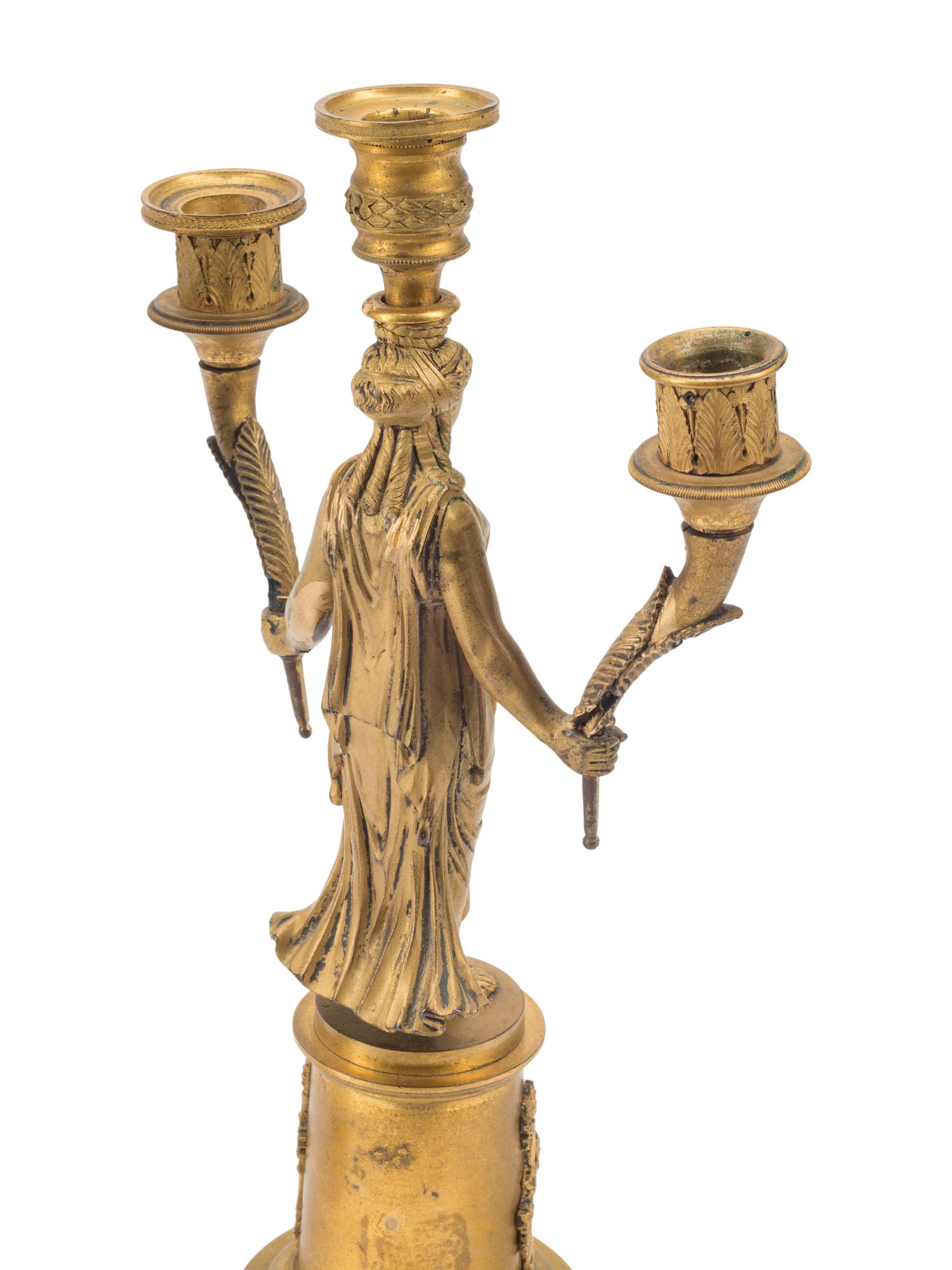 A Pair of Empire Style Gilt Bronze Three-Light Figural Candelabra