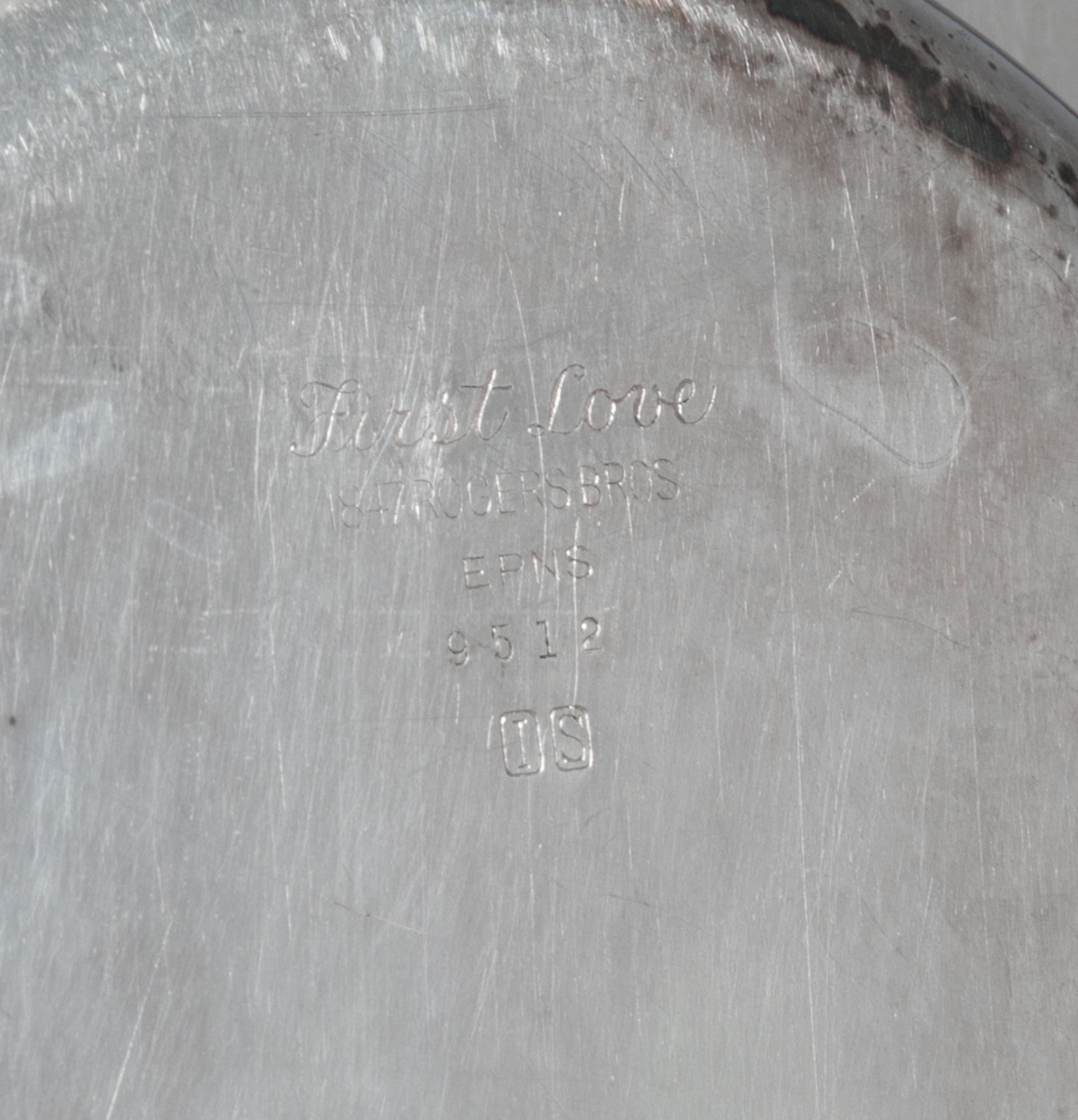 An American Silver-Plate Covered Entree Dish,, Roger Bros., 20th Century, of oval, handled form with cast foliate decoration.
