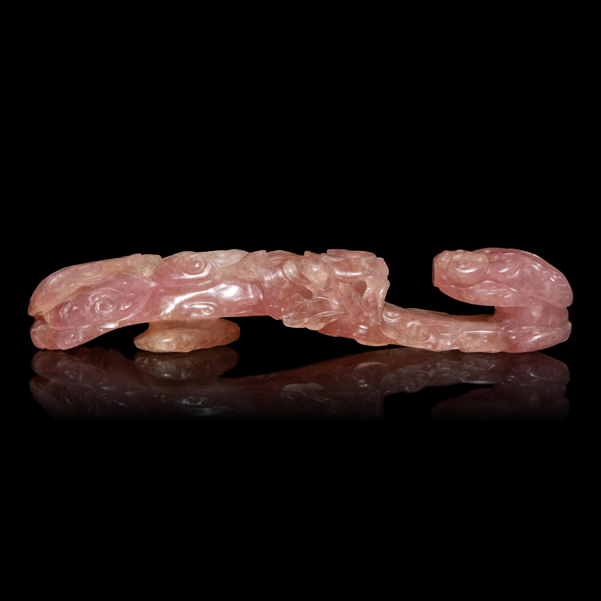 A Chinese Pink Tourmaline 'Dragon and Lingzhi' Belt Hook, 19th Century — 清晚期 碧璽螭龍帶鈎