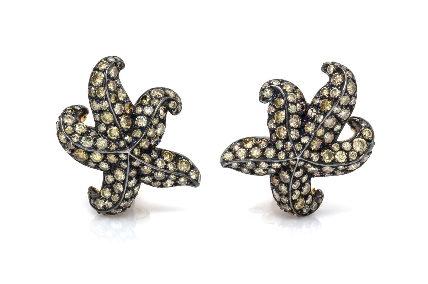 A Pair of 18 Karat Gold, Silver and Colored Diamond Earclips, Gioia, 8.50 dwts.