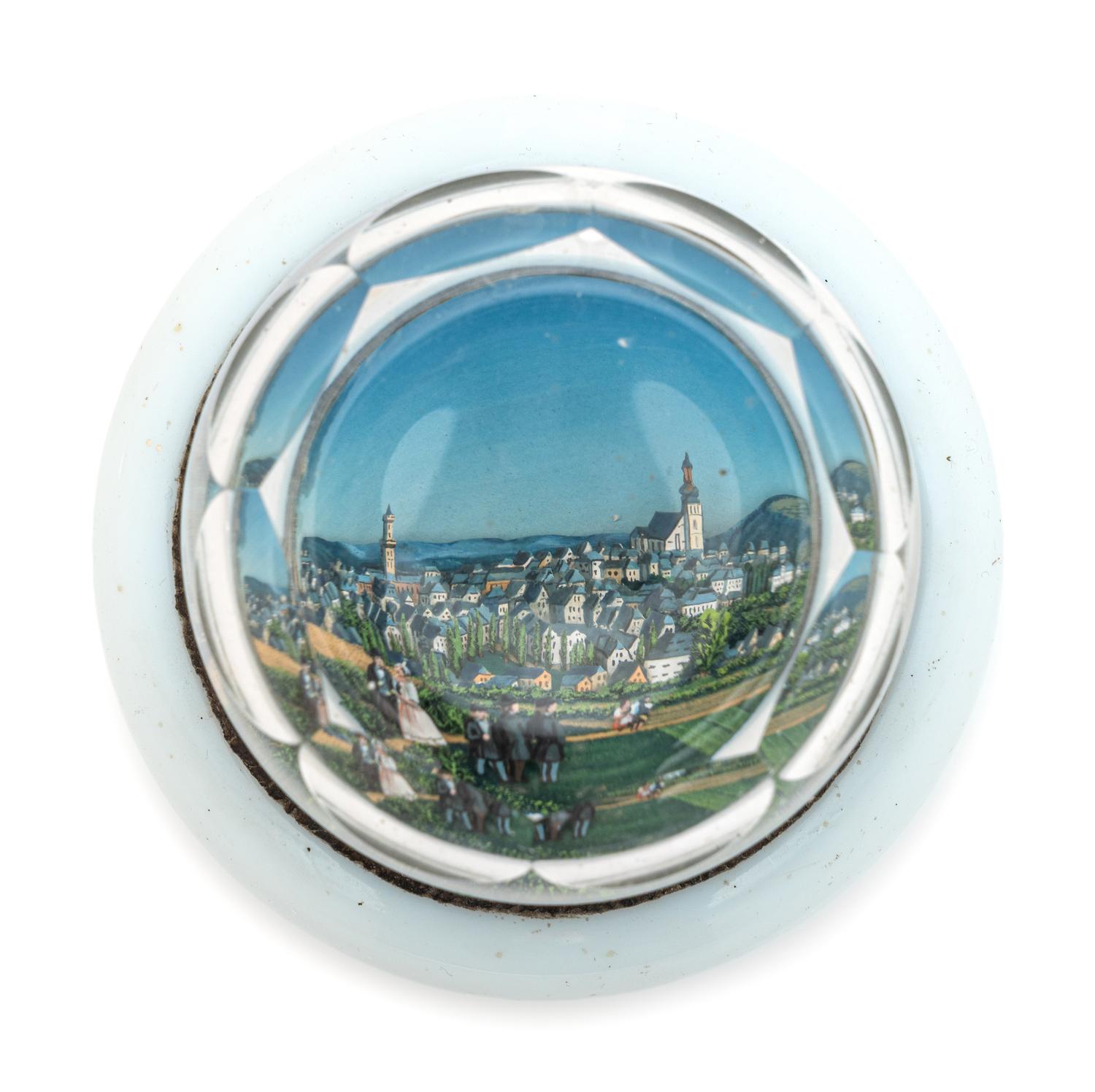 A Village Scene Diorama Faceted Glass Paperweight and a Commemorative Glass Paperweight
