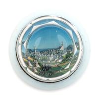 A Village Scene Diorama Faceted Glass Paperweight and a Commemorative Glass Paperweight