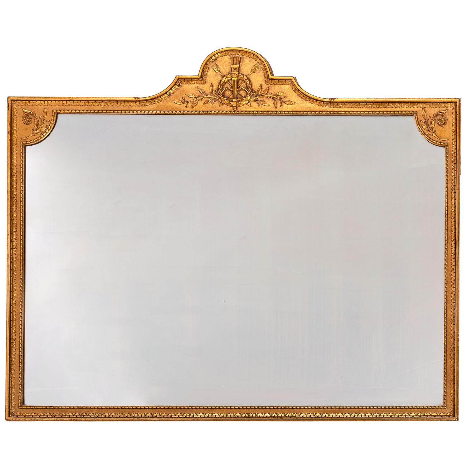 A George III Style Trophy Decorated Giltwood Overmantel Mirror