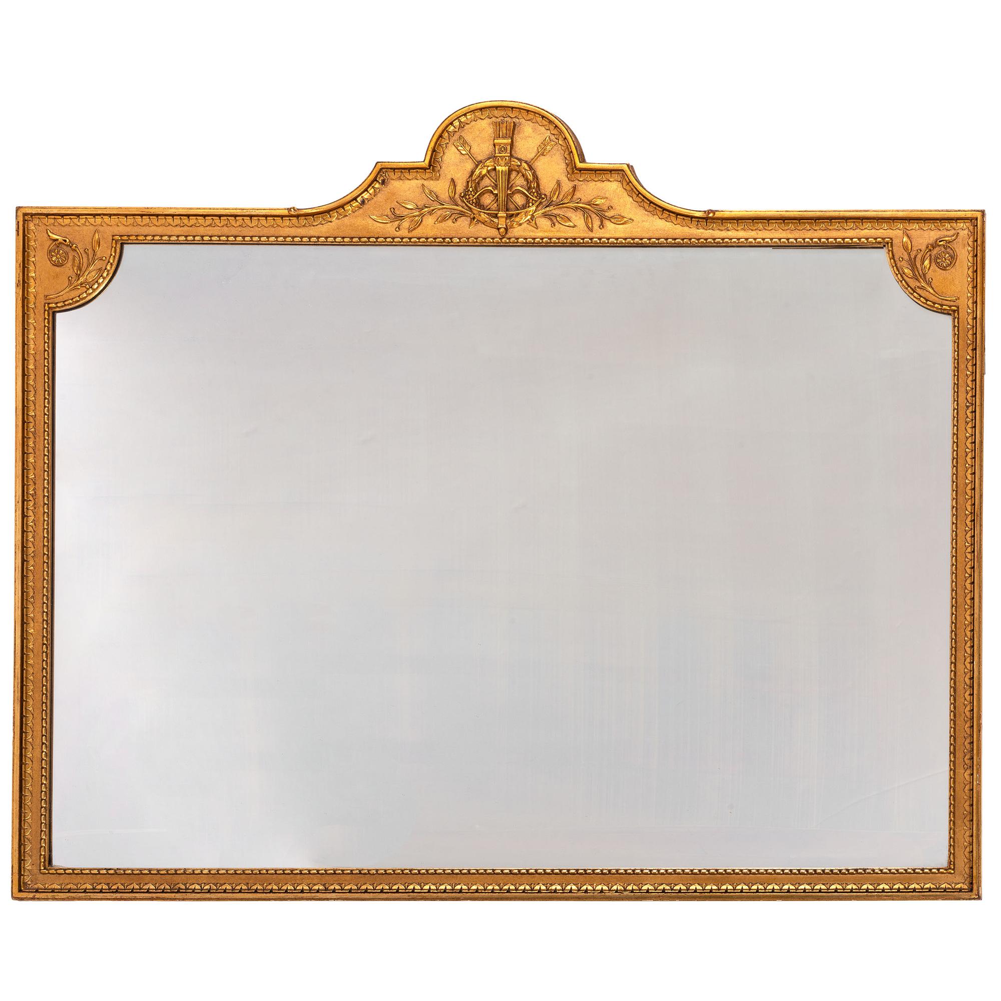 A George III Style Trophy Decorated Giltwood Overmantel Mirror