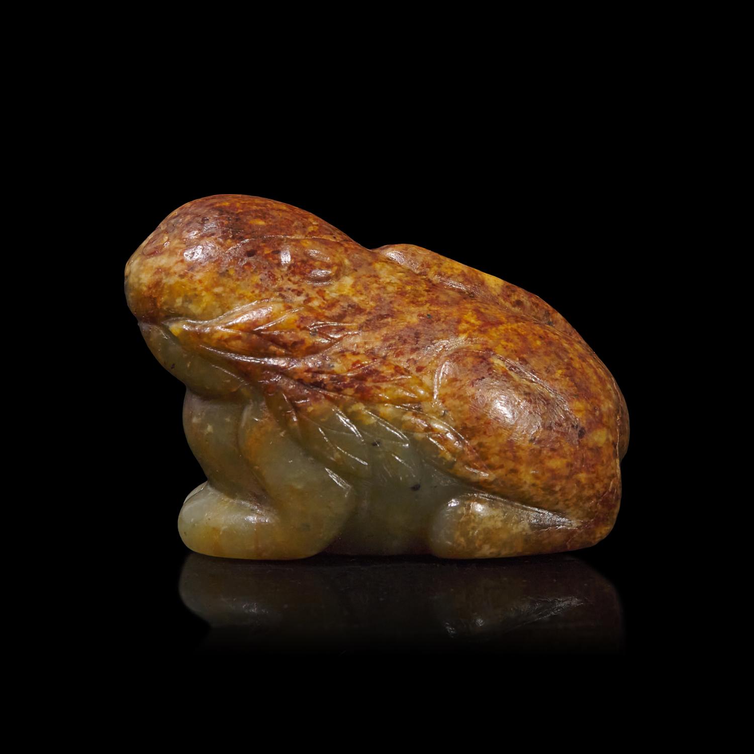 A Small Chinese Brown and Celadon Jade Mythical Beast, Ming Dynasty or Earlier 明或更早 青玉瑞獸
