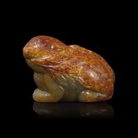 A Small Chinese Brown and Celadon Jade Mythical Beast, Ming Dynasty or Earlier 明或更早 青玉瑞獸