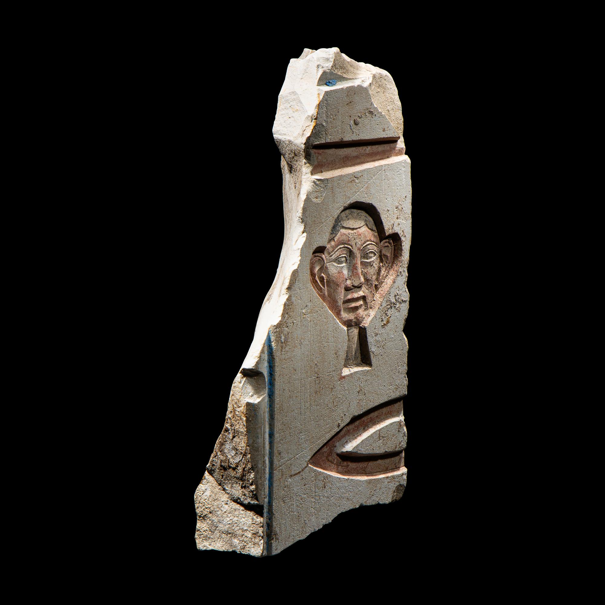 An Egyptian Painted Limestone Relief Fragment