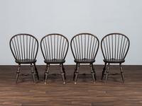 A Set of Four D.R. Dimes Black-Painted Hoop-Back Compass-Seat Windsor Chairs