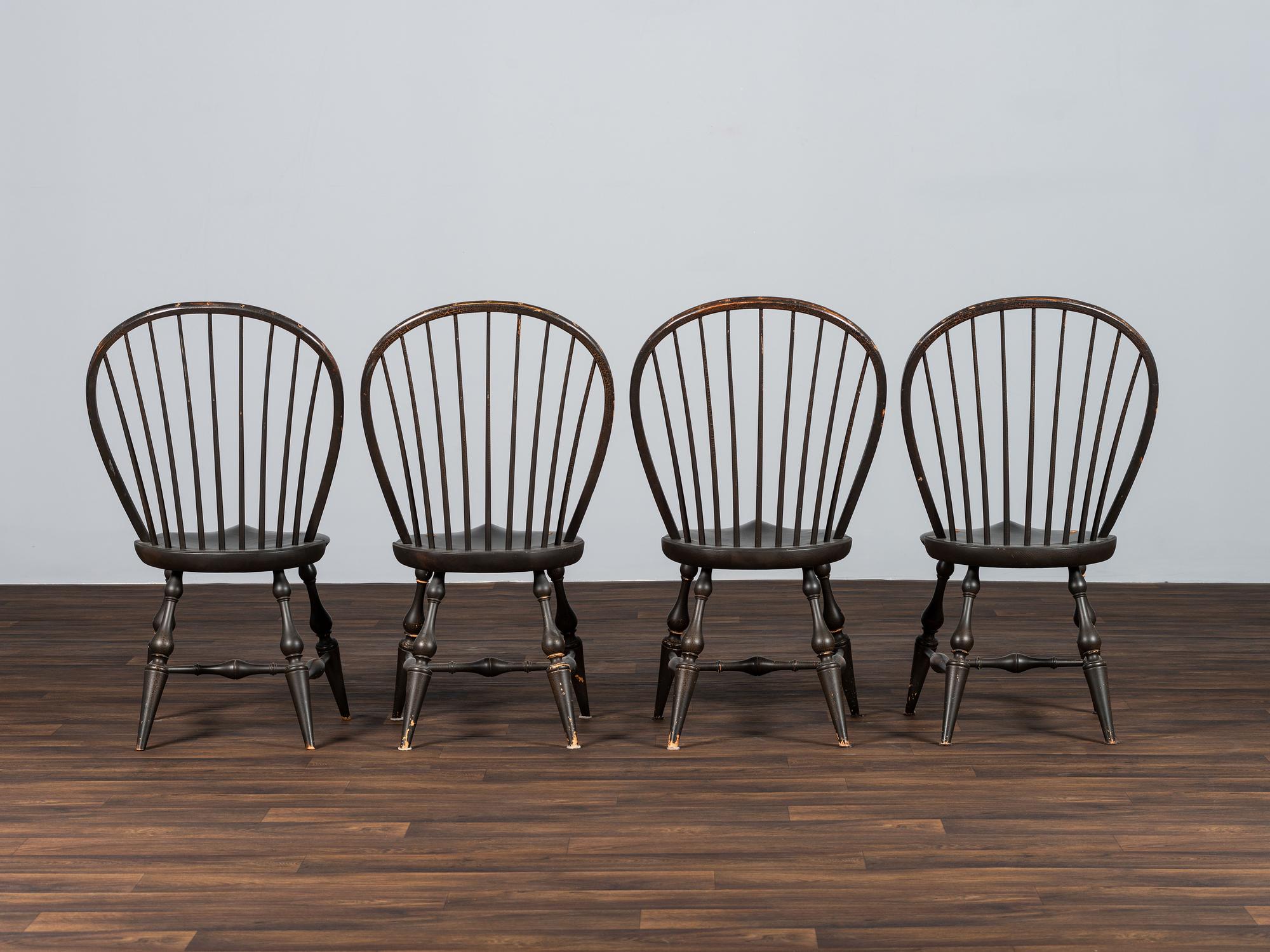 A Set of Four D.R. Dimes Black-Painted Hoop-Back Compass-Seat Windsor Chairs