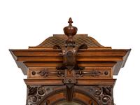 A German Carved Walnut and Marquetry Tall Case Clock