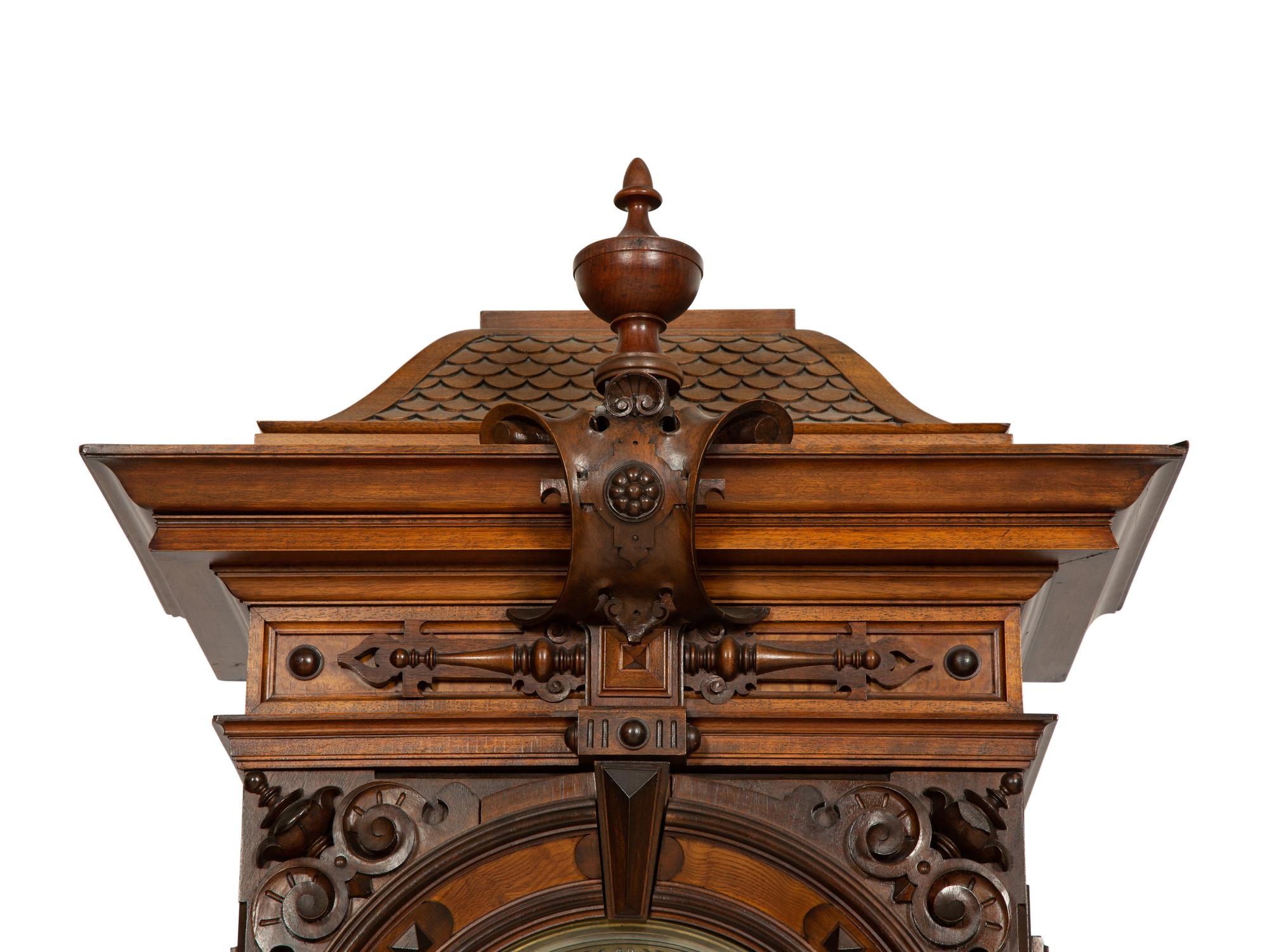A German Carved Walnut and Marquetry Tall Case Clock