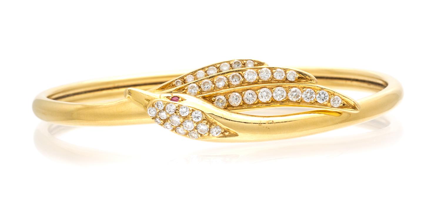 An 18 Karat Yellow Gold, Diamond and Ruby Swan Motif Bangle Bracelet, France, 11.00 dwts.