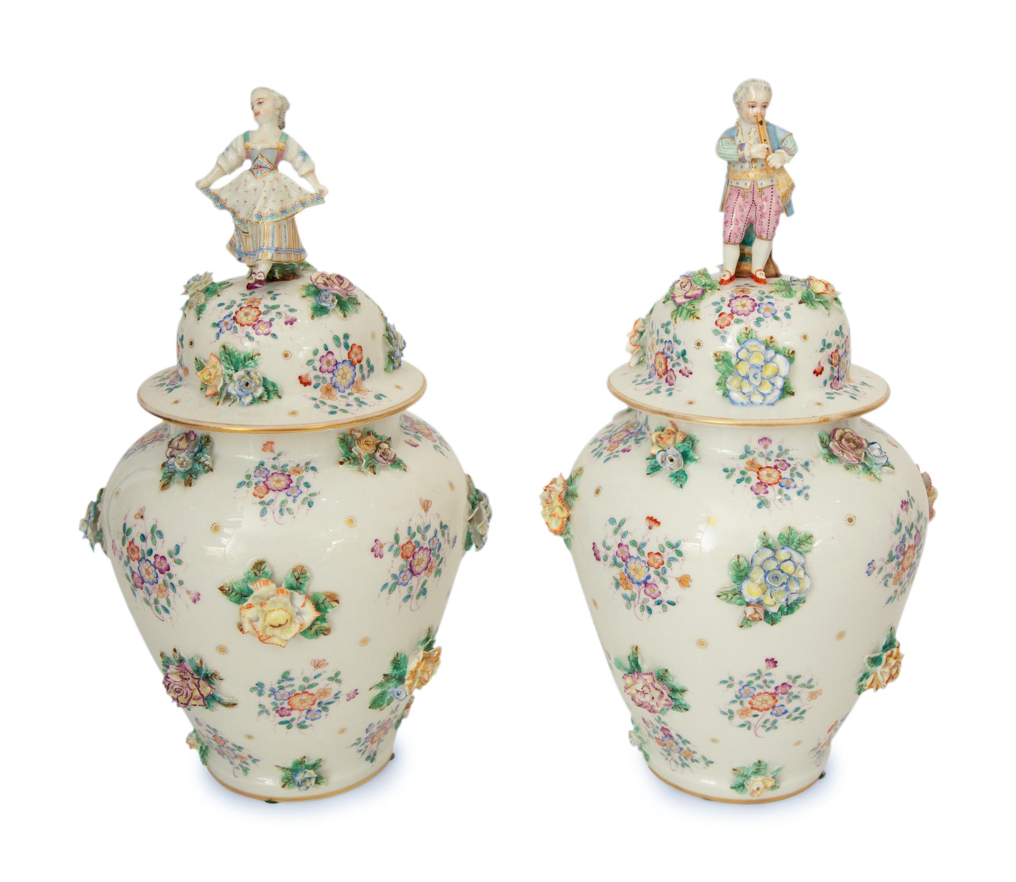 A Pair of Meissen Porcelain Covered Jars with Figural Finials