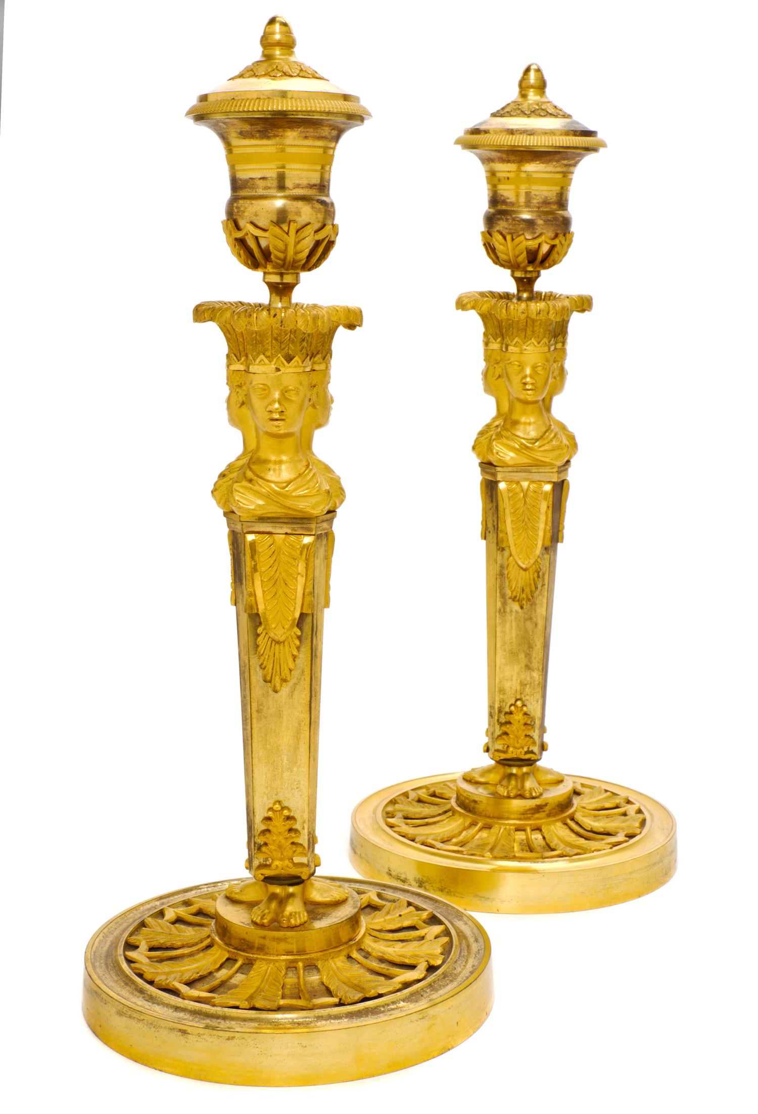 A Pair of Empire Gilt Bronze Candlesticks, EARLY 19TH CENTURY, Height 13 3/4 inches. — EARLY 19TH CENTURY,