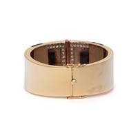 YELLOW GOLD, ONYX, AND DIAMOND HINGED BANGLE BRACELET