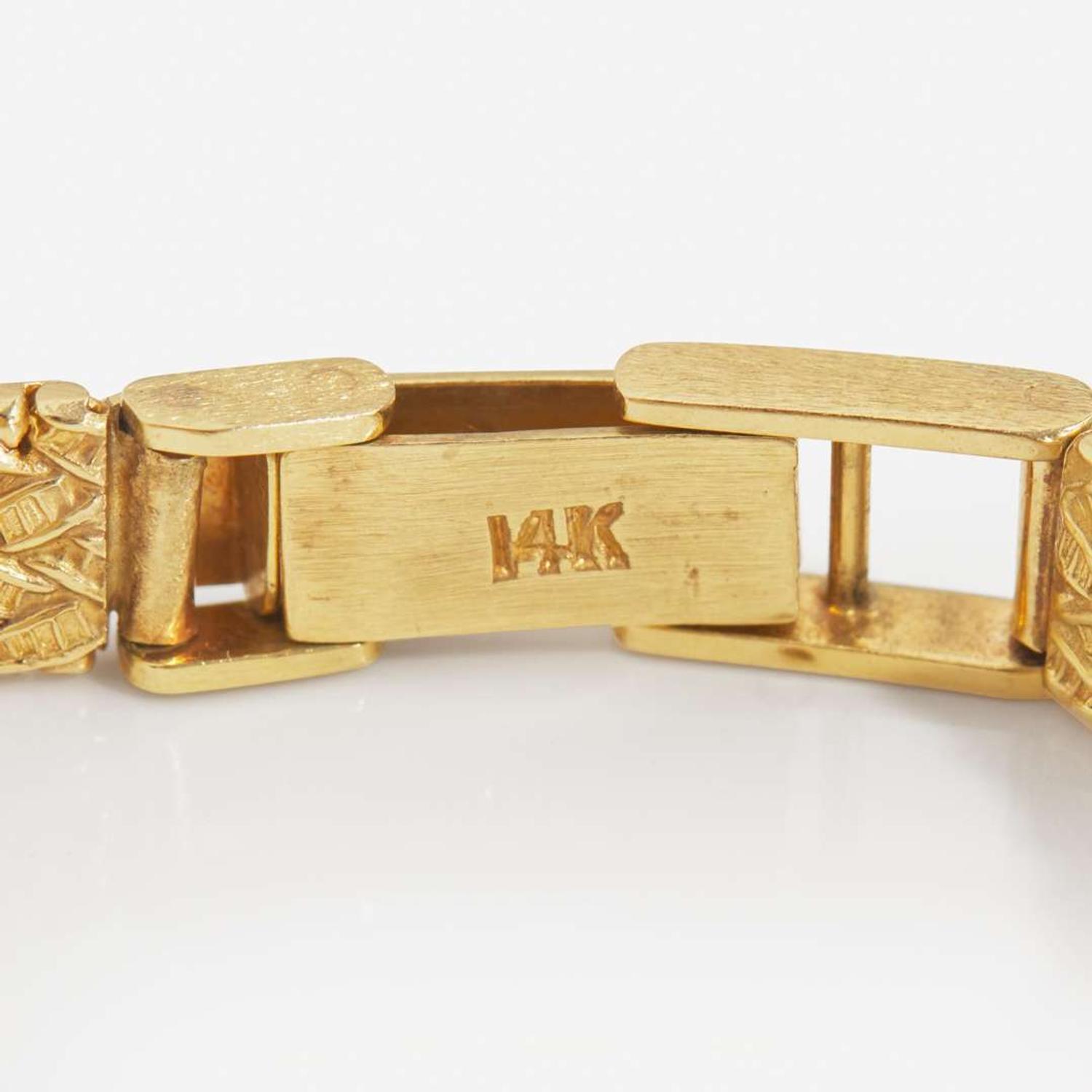 A Ladies 14K Yellow Gold and Diamond Watch