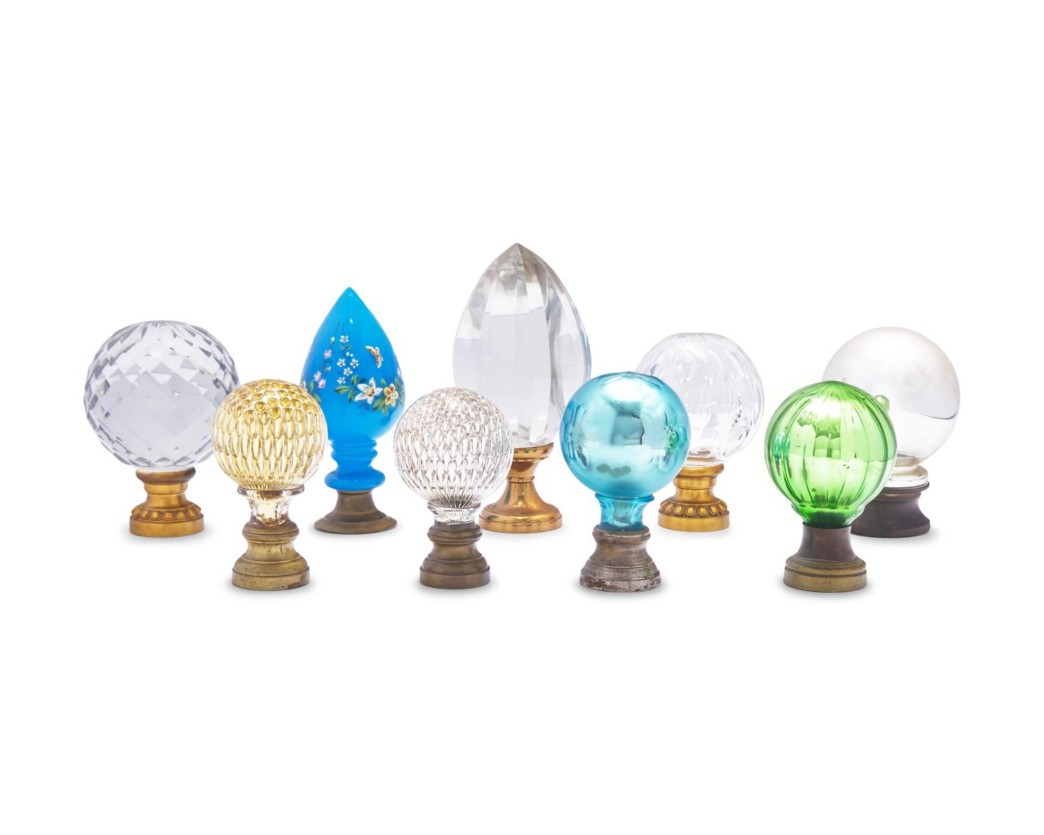 An Assembled Group of Nine Blown and Cut Glass and Metal Newel Post Finials
