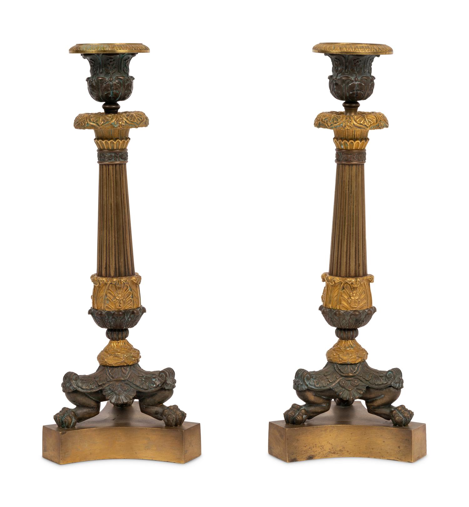 A Pair of Neoclassical Style Gilt and Patinated Bronze Candlesticks