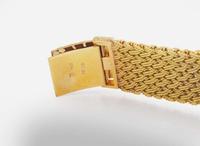 A Ladies 18K Yellow Gold Bueche Girod Watch