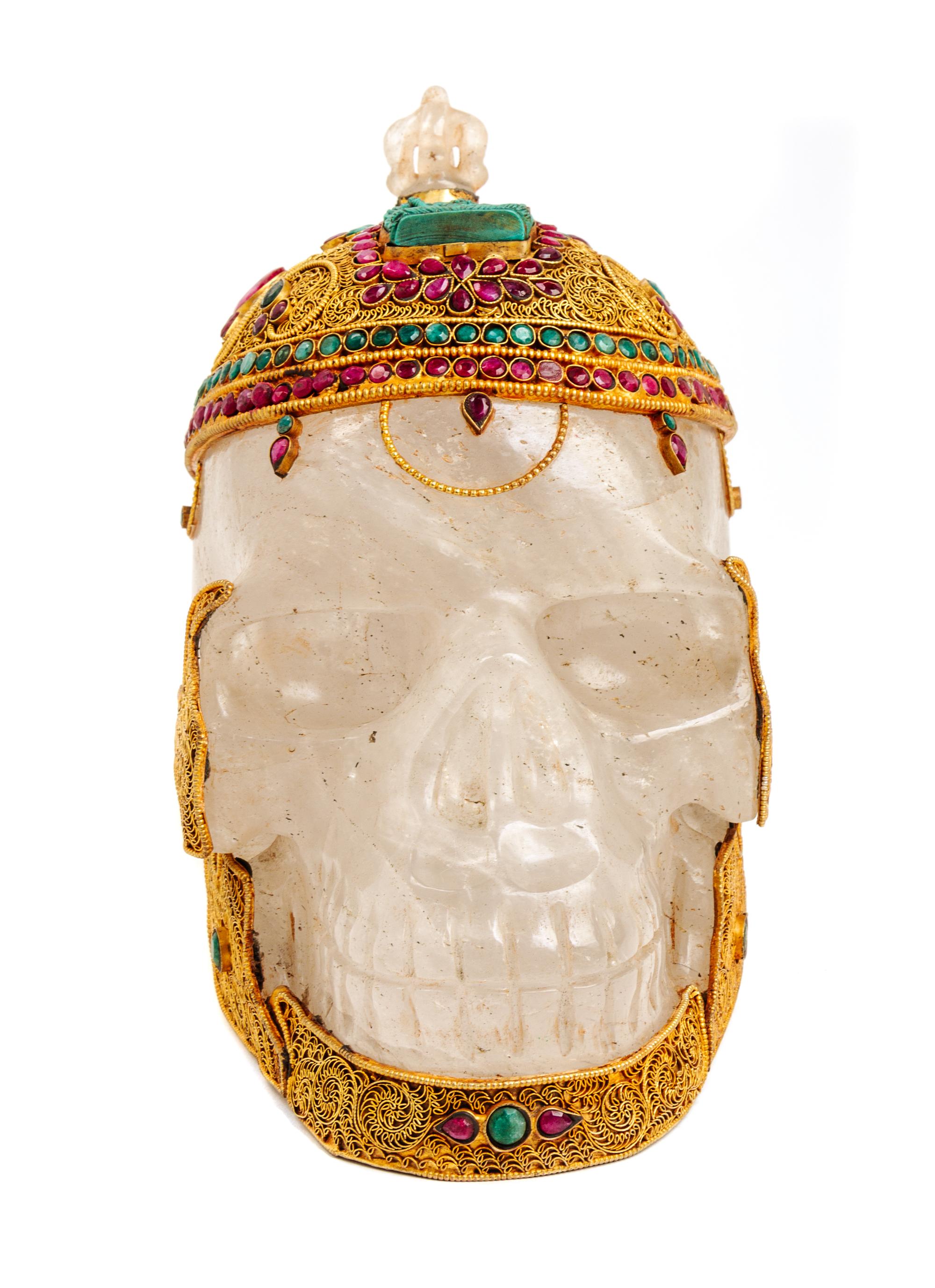 A Mughal Style Gilt Metal and Stone Inset Rock Crystal Skull Height 8 1/2 inches. — 20TH CENTURY