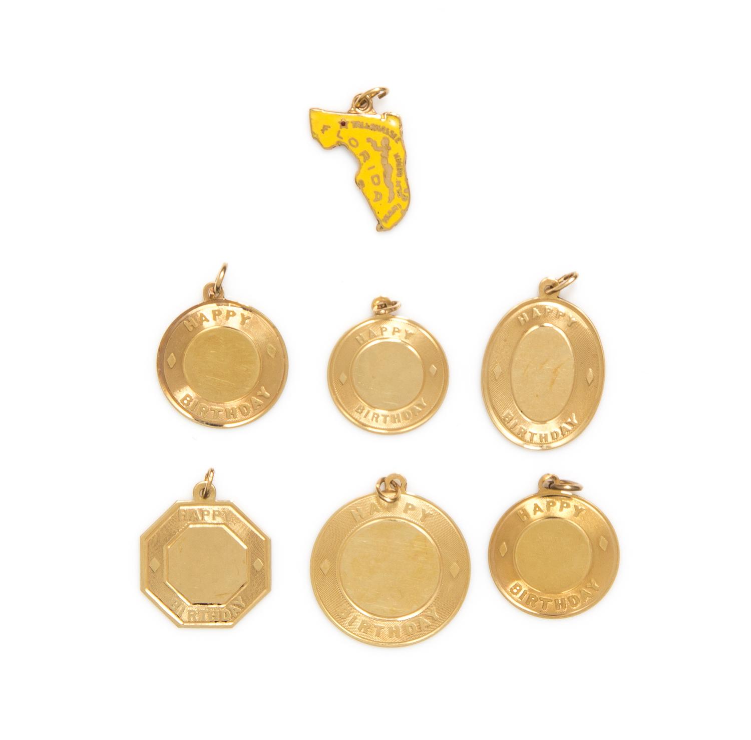 A Collection of 14 Karat Yellow Gold Charms, 10.80 dwts.
