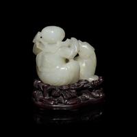 A Chinese White Jade Carving of Boy and Mythical Beast 白玉童子瑞獸把件